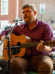 Poet Mathew Parsons at The Book Cellar in Abingdon Virginia playing guitar