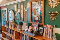 The Book Cellar Green Wall, Products, and Book shelf