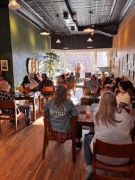 Crowd at open mic poetry night at The Book Cellar